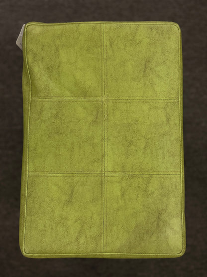 A wooden backless barstool featuring a lime green cushioned leather seat with brass nailhead accents in good condition.