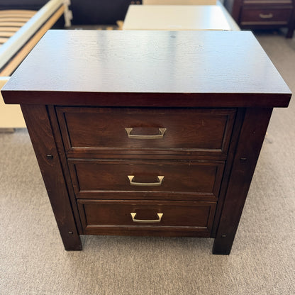 A modern dark-wood queen platform bed frame with a horizontal-paneled headboard, six footboard storage drawers, and matching three-drawer nightstands.