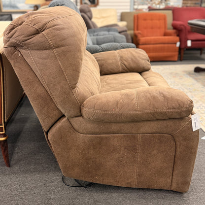 A wide plush power recliner chair featuring a segmented headrest, pillow-top arms, and heavy contrast stitching in good condition.