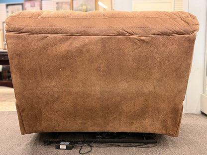 A wide plush power recliner chair featuring a segmented headrest, pillow-top arms, and heavy contrast stitching in good condition.