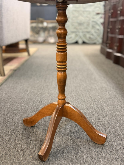 Round wooden pedestal accent table with a tripod base and a hand-painted rustic fruit and leaf border around the tabletop.