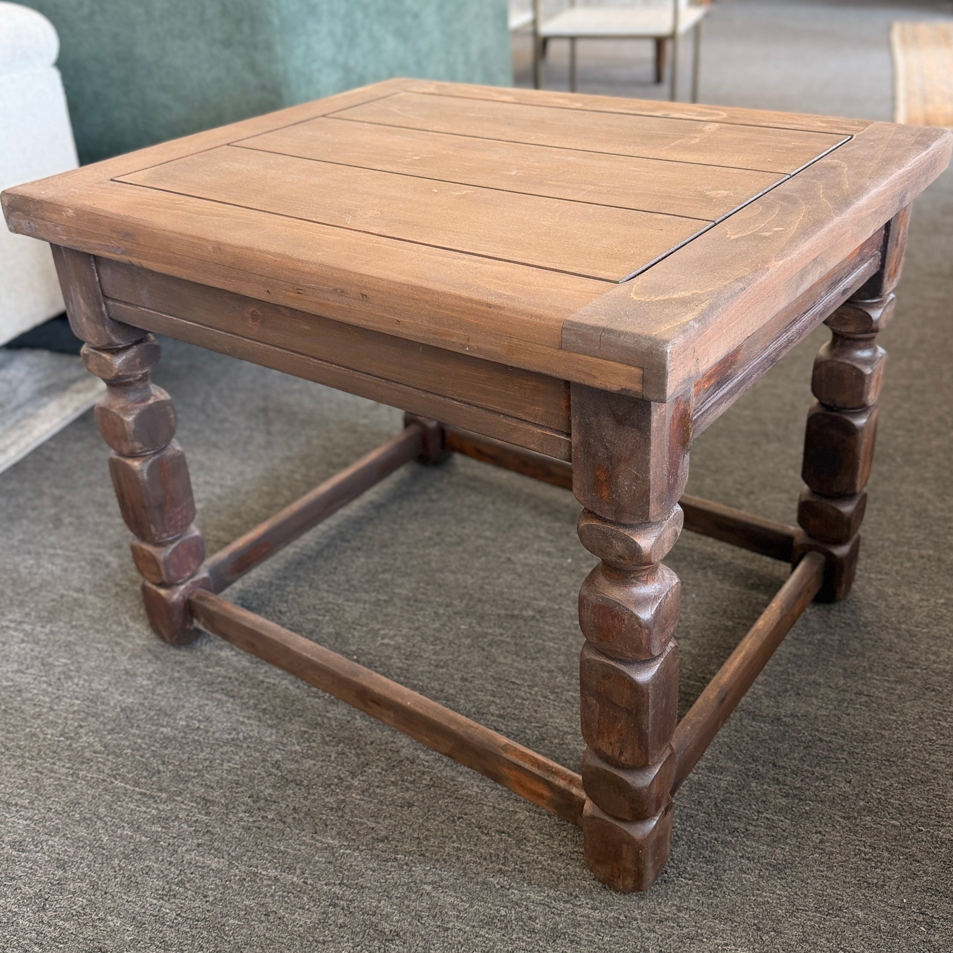 Rustic solid wood square end table featuring a plank-style top, chunky turned legs, and a sturdy lower support frame.
