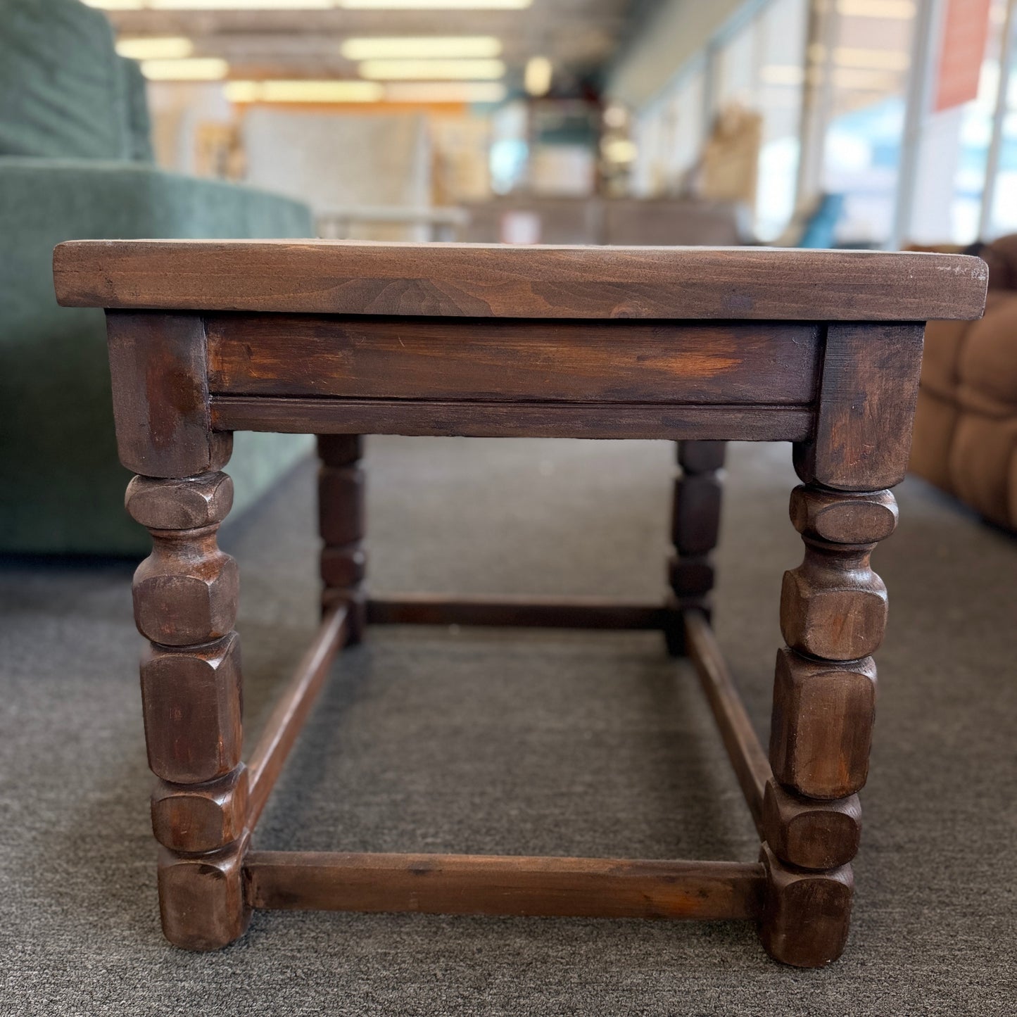 Rustic solid wood square end table featuring a plank-style top, chunky turned legs, and a sturdy lower support frame.