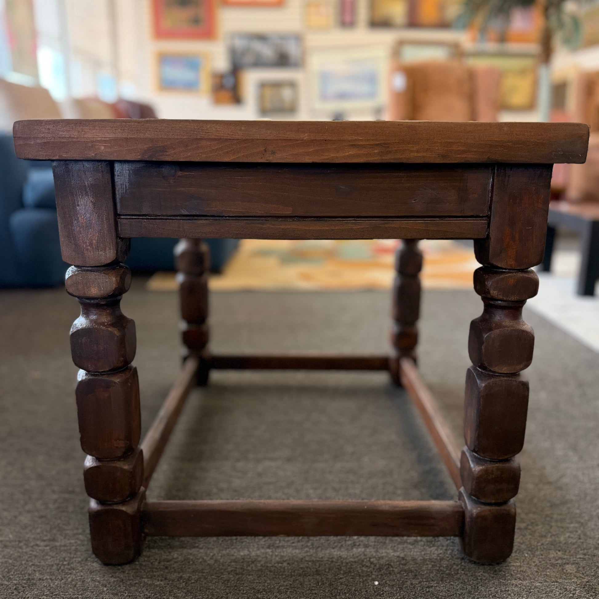 Rustic solid wood square end table featuring a plank-style top, chunky turned legs, and a sturdy lower support frame.
