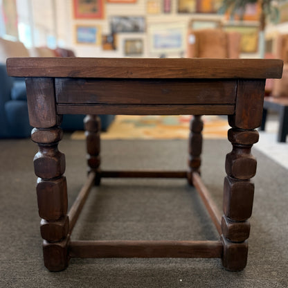 Rustic solid wood square end table featuring a plank-style top, chunky turned legs, and a sturdy lower support frame.