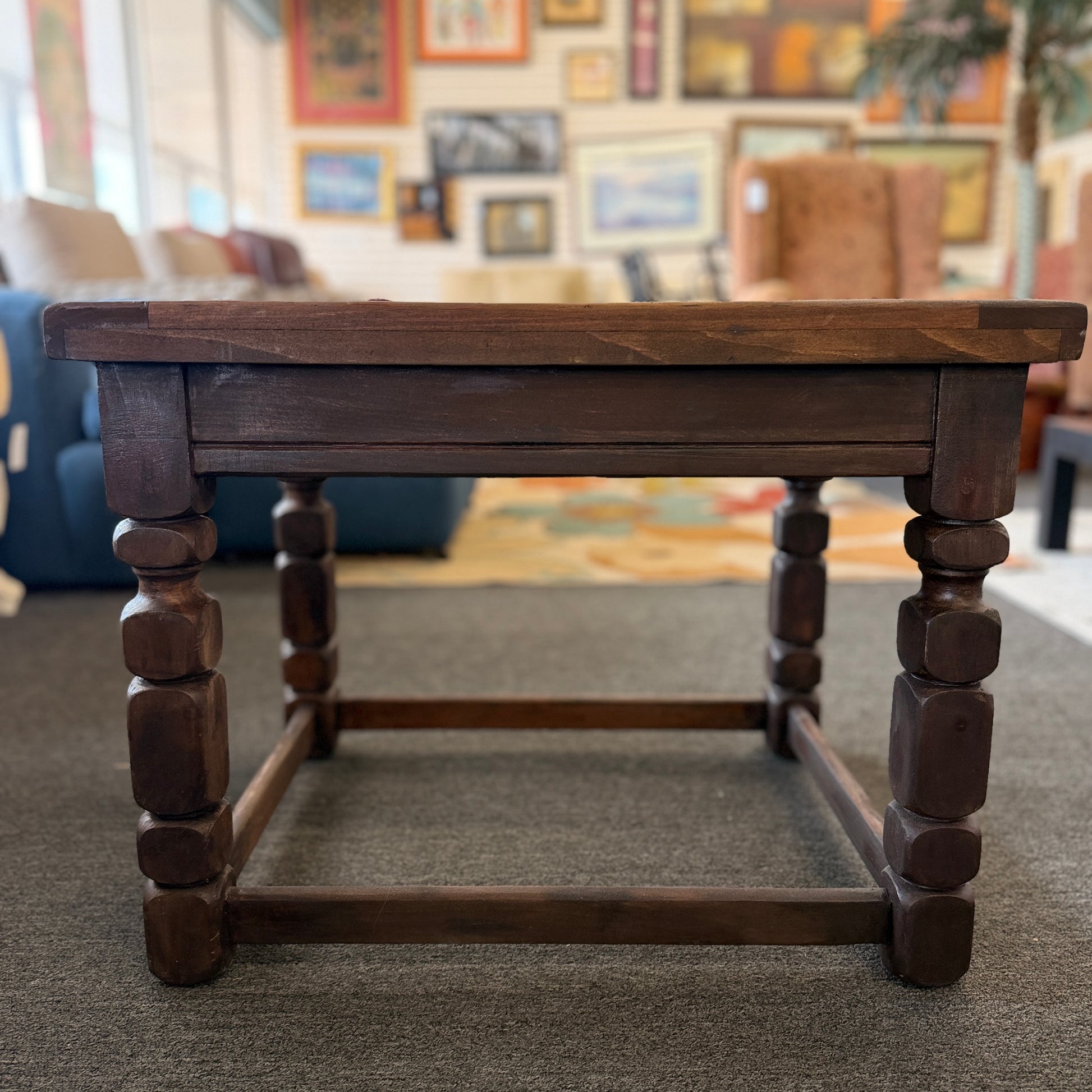 Rustic solid wood square end table featuring a plank-style top, chunky turned legs, and a sturdy lower support frame.