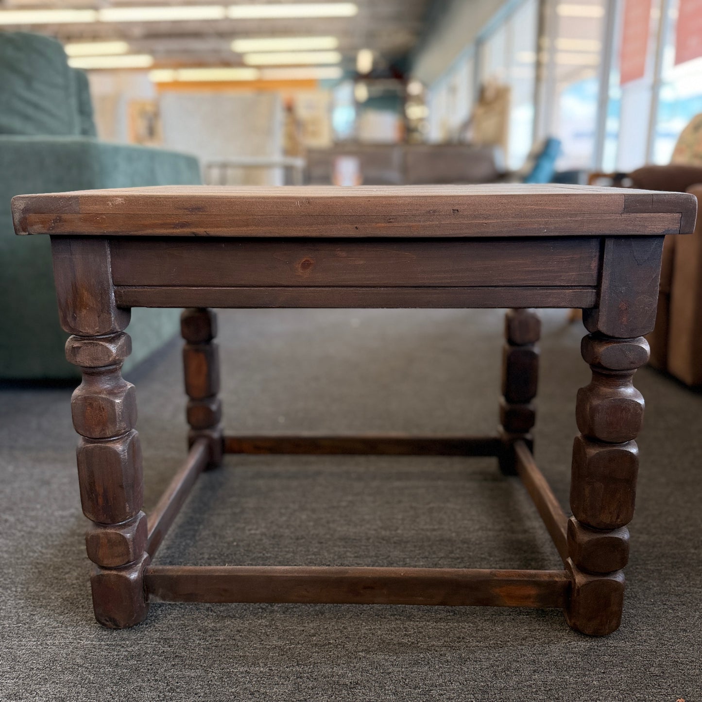 Rustic solid wood square end table featuring a plank-style top, chunky turned legs, and a sturdy lower support frame.