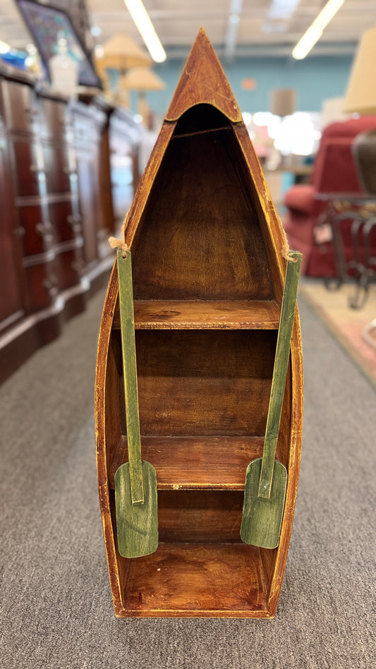 Rustic vertical wooden row boat and canoe nautical wall decor sculpture with green oars on a gray floor at 2nd Debut Houston consignment showroom