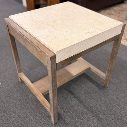 Square end table featuring a thick light-colored stone top, distressed wood frame, and a lower crossbar shelf with rustic styling.