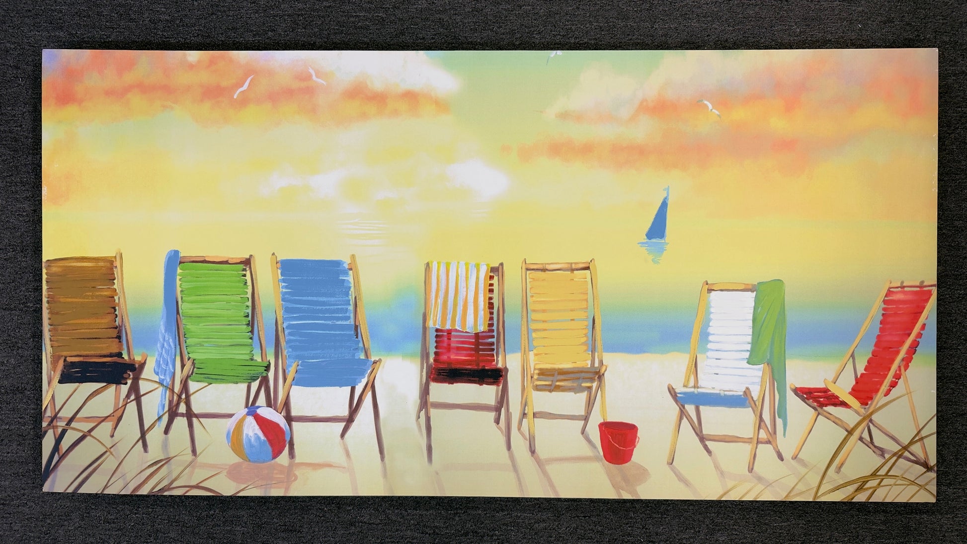 A wide horizontal canvas painting illustrating a vibrant row of empty beach chairs on the sand facing a pastel-colored ocean sunset.