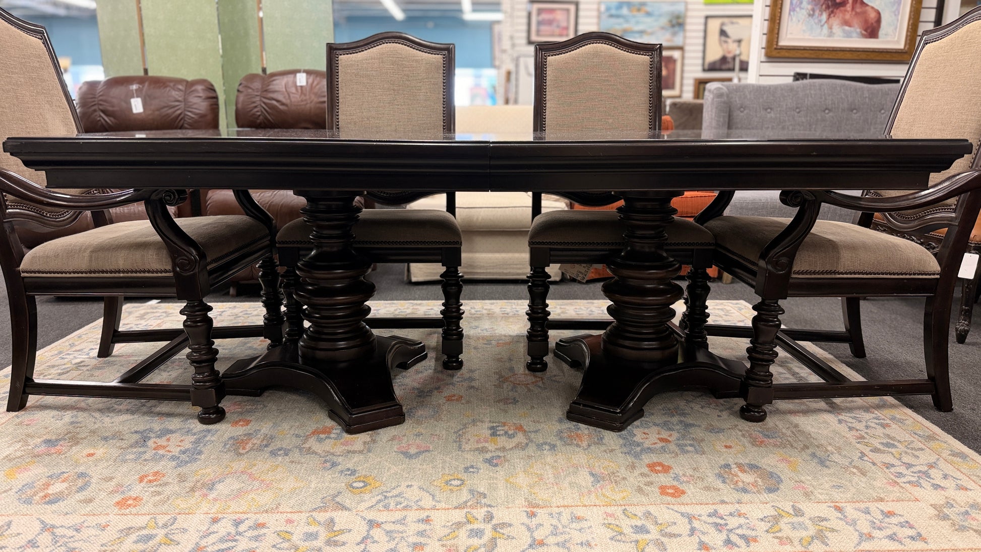 A traditional 7-piece dining set featuring a large rectangular wooden table, two high-back host armchairs, and four matching side chairs with fabric upholstery.