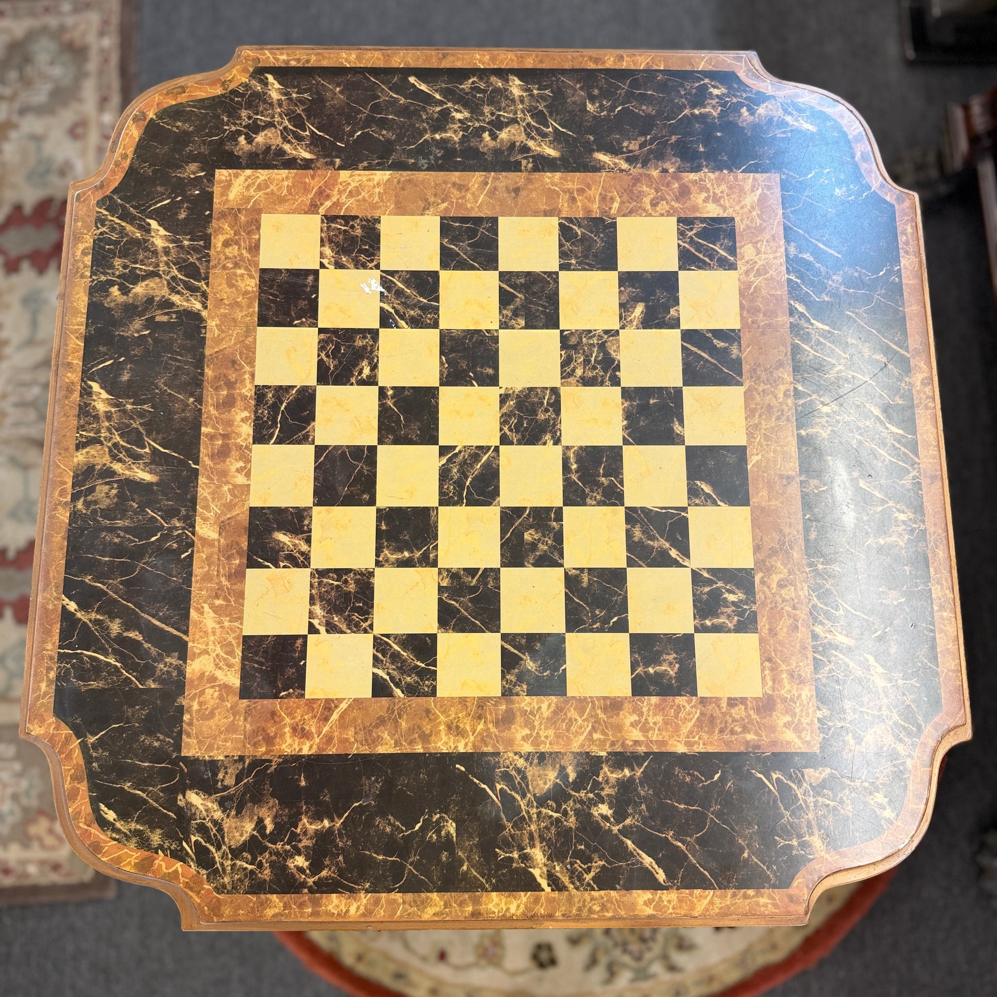 A traditional wooden pedestal chess table featuring a built-in inlaid chessboard surface, a single storage drawer with a ring pull, and a carved urn-shaped pedestal base.