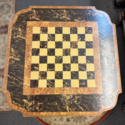 A traditional wooden pedestal chess table featuring a built-in inlaid chessboard surface, a single storage drawer with a ring pull, and a carved urn-shaped pedestal base.