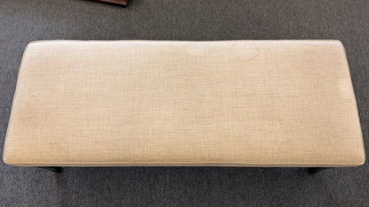 A 52-inch wide upholstered bedroom bench featuring a cushioned fabric top supported by a sturdy wooden frame.