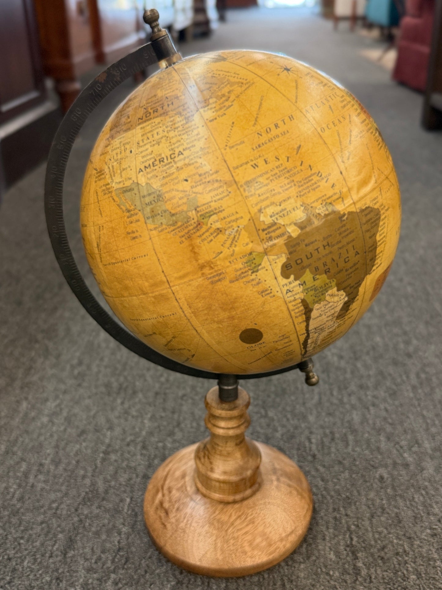 A vintage-inspired 14-inch desktop globe featuring a warm sepia-toned antique map, a dark metal meridian, and a classic turned-wood pedestal base.