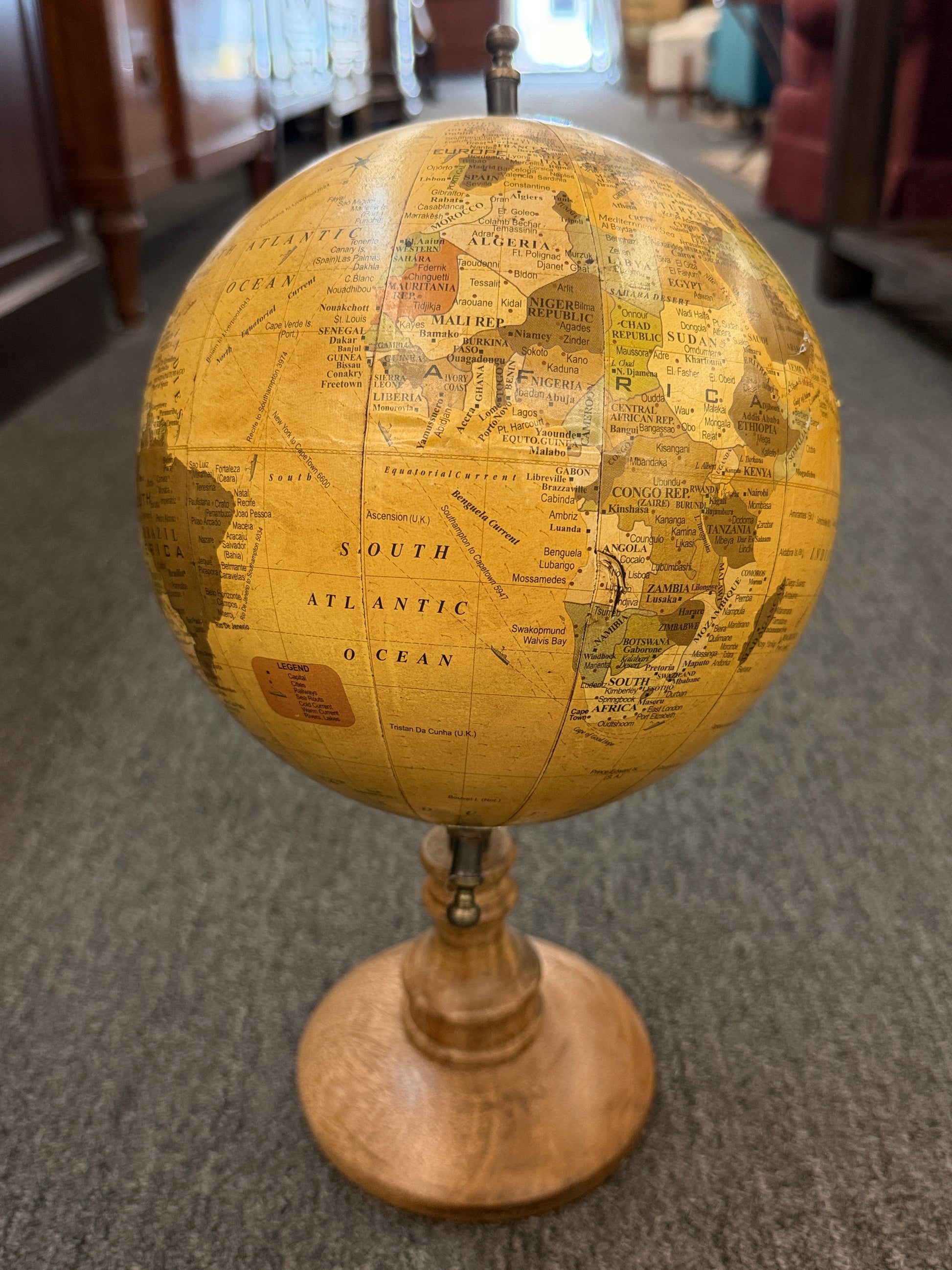 A vintage-inspired 14-inch desktop globe featuring a warm sepia-toned antique map, a dark metal meridian, and a classic turned-wood pedestal base.